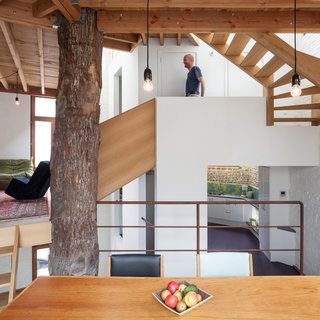 In the kitchen, the original unpainted brick can be glimpsed. The floors are polyurethane.