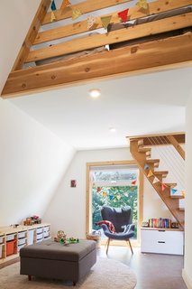 Decorated with colorful flags handmade by Christine, the kids’ light-filled play-space can easily be converted into a second bedroom.