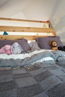 The cozy loft-space above the kids’ playroom can be used as an additional sleeping area.