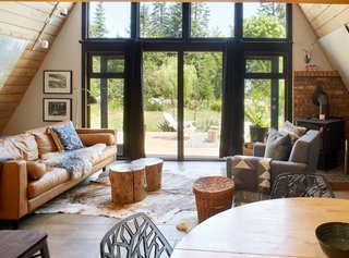 The home is heated primarily by wood, but has electric baseboards in the main living area.