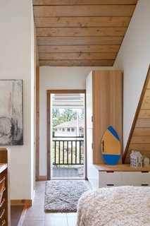 The master bedroom enjoys direct access to the outdoor balcony.