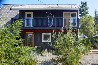 The covered second-floor balcony boasts stellar ocean views.