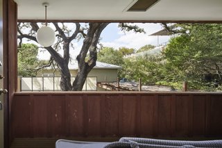 The second-floor balcony on the west side overlooks views of the majestic live oak.