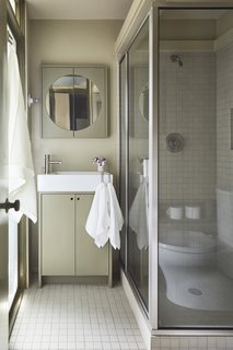 The bathroom was updated with new flooring and plumbing fixtures.