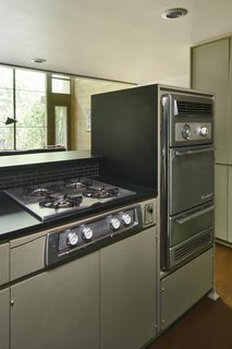 All three units still have their original cooktops and ovens. A dishwasher (not pictured) was a new addition.