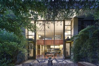 Surrounded by tall elms and thick bamboo, the rear garden is a private oasis.