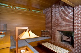 Tarantino Architect's extension includes a heightened clerestory lounge with built-in seating. Great care was taken to match the original materials and details.