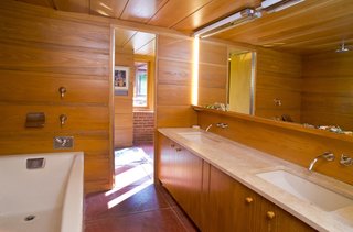 The master bath includes a double vanity as well as a jacuzzi tub with rain shower.