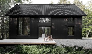 A large cedar deck offers outdoor entertaining opportunities. The outdoor furnishings are by COOP Etabli.
