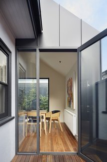 The glazing and doors are double-glazed Capral 400 series aluminum.
