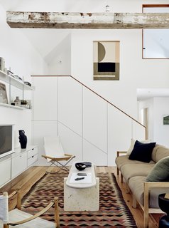 The living room features a Yucca Stuff coffee table, as well as a sofa that was designed by Austin interior designer Ann Edgerton and built by Tyson Pendergrass.