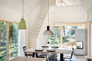 Large windows pulls views of the landscape indoors to create an immersive experience in the open-plan living spaces.