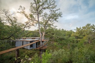 The roof is standing-seam galvanized metal and the siding is Thermory driftwood.
