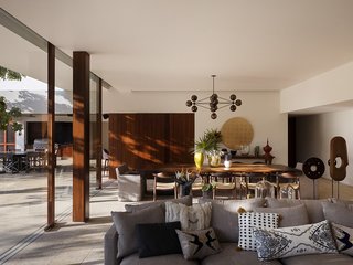 The home's restrained material palette of timber and white stucco walls defers to the landscape. The floors are Coralina Stone.