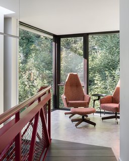 Vintage Adrian Pearsall swivel chairs with upholstery by HM Duke Design anchor the stair landing along with an Urbia Vinya side table.