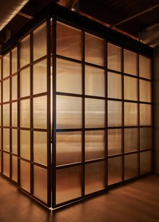The bedroom enclosure illuminated at night.
