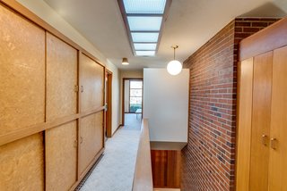 A novelty for its time, the skylight floods the central hallway with natural light.