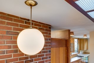 A close-up view of one of the home's original lighting fixtures.