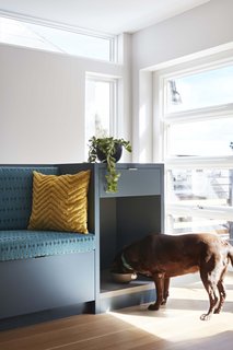 "At the end of the cabinet, one finds a small compartment for their beloved dog, Lucky, to eat her meals," Choe shares. "The client told me their cat also likes to nap in this nook. This wasn't the intent, but I'm delighted that the cat has found a way to make a room out of it."