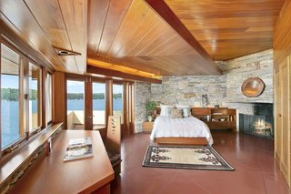 The master bedroom overlooks panoramic views of the lake.