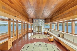 A view inside the cantilevered great room that terminates with a double-sided fireplace.