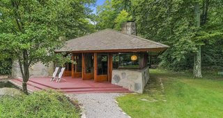 The guesthouse, located across the lawn, houses three bedrooms.