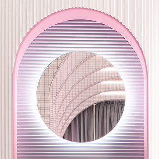 Repeating arches, asymmetrical shapes, and color gradients give the dressing a feeling of "infinite depth." The textured walls are by Orac Decor.