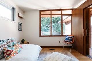 The second bedroom looks out over the brick patio and entry.