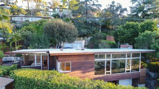 The house faces north and slightly west. The living spaces and the master bedroom overlook city and mountain views.
