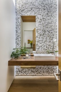 A peek inside the guest bath next to the entry.
