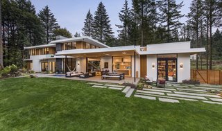 The contemporary home is marked by long horizontal planes and clean lines. Giulietti Schouten Architects crafted it with an eye for timeless design.