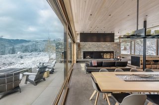 The massive wood-burning hearth is built of Mountain Ash granite with a shou sugi ban accent above.