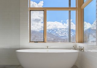 A Victoria + Albert Barcelona tub overlooks stunning landscape views.
