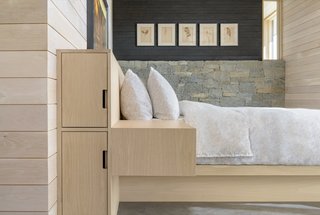 Built-in storage and blonde wood contributes to the home’s sleek and minimalist appearance.