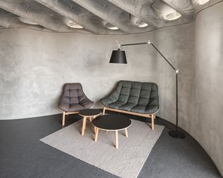The curve of the Mesh Mould wall creates a snug nook for the living room.