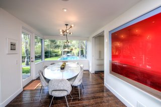 The dining room overlooks the pool. 