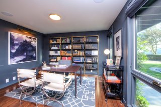The ground-floor office is wrapped in walls of blue. 