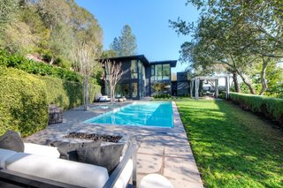 Built in 1950 and extensively remodeled over the years, the L-shaped midcentury house is optimized for indoor/outdoor living. 