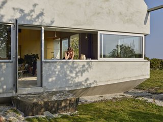 The clients' request for a mouse-proof house informed the shape of the home and the use of cast concrete for the foundation.