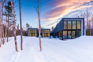 This 1,900-square-foot home was assembled on-site in just two days with wall panels consisting of staggered 2' x 4' studs on a 2' x 8' plate, which eliminates thermal bridging and maximizes energy efficiency.