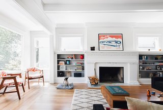 The updated living room of the Roanoake Park Residence received a fresh coat of paint and plenty of floor space for the family dog to play. Best Practice took great care to highlight and contrast the existing traditional details of the house. Original doors, railings, hardware, and many of the windows were carefully salvaged, cleaned, and reused in conjunction with new elements.