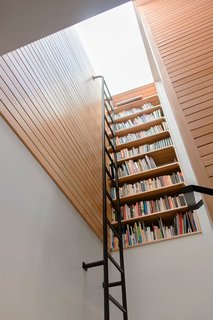Top 5 Homes of the Week With Libraries We Love - Photo 2 of 5 - Vertical bookcase at stair landing