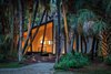 Modern home with Exterior, Shed Building Type, House, Cabin Building Type, Farmhouse Building Type, Tiny Home Building Type, Treehouse Building Type, Small Home Building Type, Metal Roof Material, Wood Siding Material, Metal Siding Material, and Shed RoofLine. Front Photo of Mike's Hammock