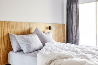 When flipping your mattress and airing out your bedding, don't forget to take smaller rugs or carpets outdoors to shake the dust out before vacuuming.