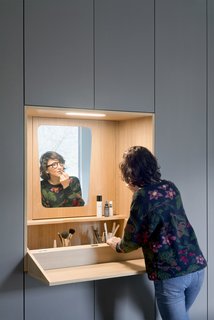 A fold-out vanity tucks away when not in use.