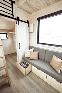 This built-in custom couch offers ample storage underneath.