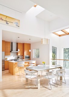 Oakland Hills I was designed by architect Andrew Morrall and his partner as a place to live and work in. High ceilings, skylights, and a plentitude of windows connect the home to the surrounding forest.