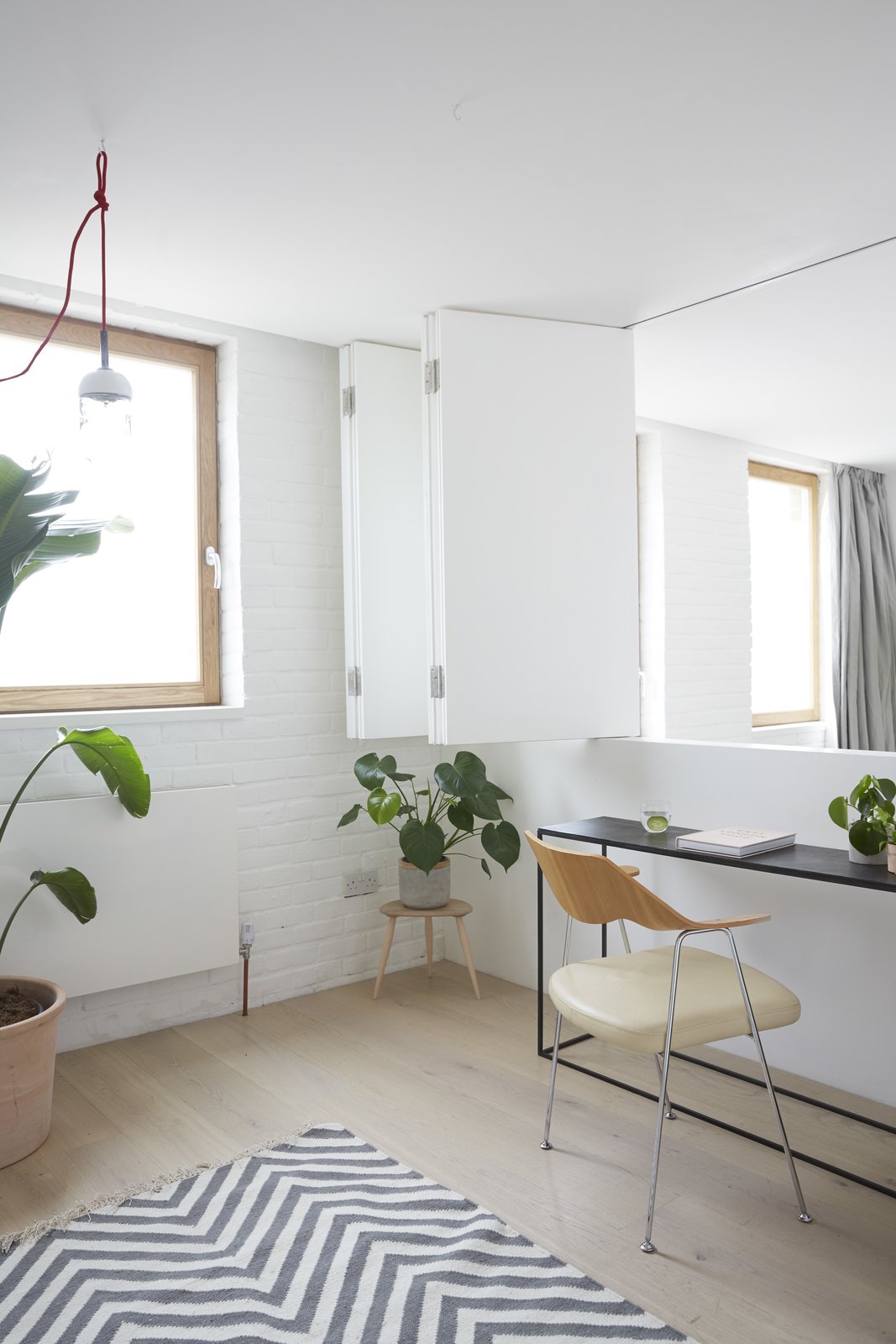 The flexible home-office space overlooks the living room below