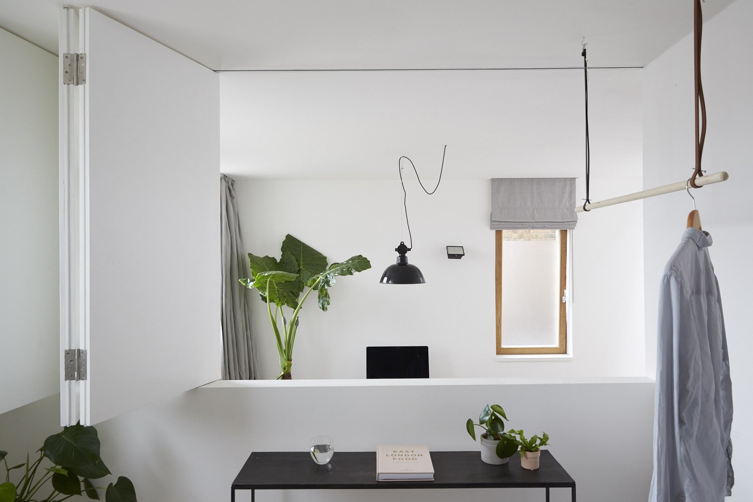 The flexible home-office space overlooks the living room below