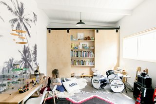 Inside, the playfulness continues in Gram's room. The custom closets and bookshelves are Rael Made.